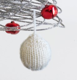 Closeup of our knitted Christmas Tree Bauble, free pattern