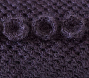 Image of the crochet detail on our Mesh Throw with Crochet Trims